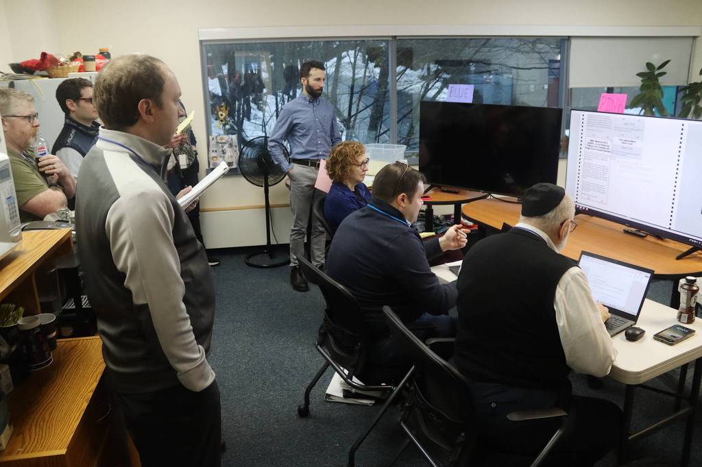 A recount of ballots from the Nov. 5 election is observed Wednesday morning by Alaska Division of Elections officials and participants in a challenge to the outcome of a measure to repeal ranked choice voting in the state. The recount at the division directors office in Juneau began Tuesday and is expected to last up to 10 days. (Mark Sabbatini / Juneau Empire)