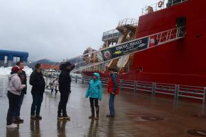 Crew of the U.S. Coast Guards Healy icebreaker talk with Juneau residents stopping by to look at the ship on Thursday at the downtown cruise ship dock. Public tours of the vessel are being offered from 3:30-5:30 p.m. Friday. (Mark Sabbatini / Juneau Empire)
