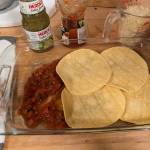 Layering tortillas and other ingredients for a casserole. (Photo by Patty Schied)