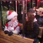 Evelyn Whistler, 11, and her mother, Shannon, ride the Holiday Trolley from the Alaska State Museum to downtown Juneau during Gallery Walk on Friday. (Mark Sabbatini / Juneau Empire)