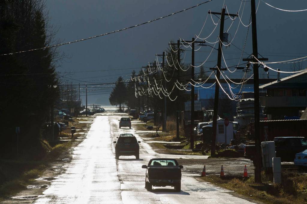 Industrial Boulevard on Nov. 21, 2018. A dump truck that allegedly stolen early Saturday morning hit overhead power lines on the street, knocking out power to the area. (Michael Penn / Juneau Empire file photo)