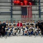 The Juneau-Douglas High School: Yadaa.at Kalé Crimson Bears pose with the Kodiak Bears and Santa Claus after Saturdays 9-0 win at Kodiak. (Photo courtesy JDHS Hockey)