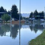 An intersection in the Mendenhall Valley is submerged during record flooding from Suicide Basin on Aug. 6. A report published last week states such flooding is the result of glacier melt occurring due to climate change. (City and Borough of Juneau photo)