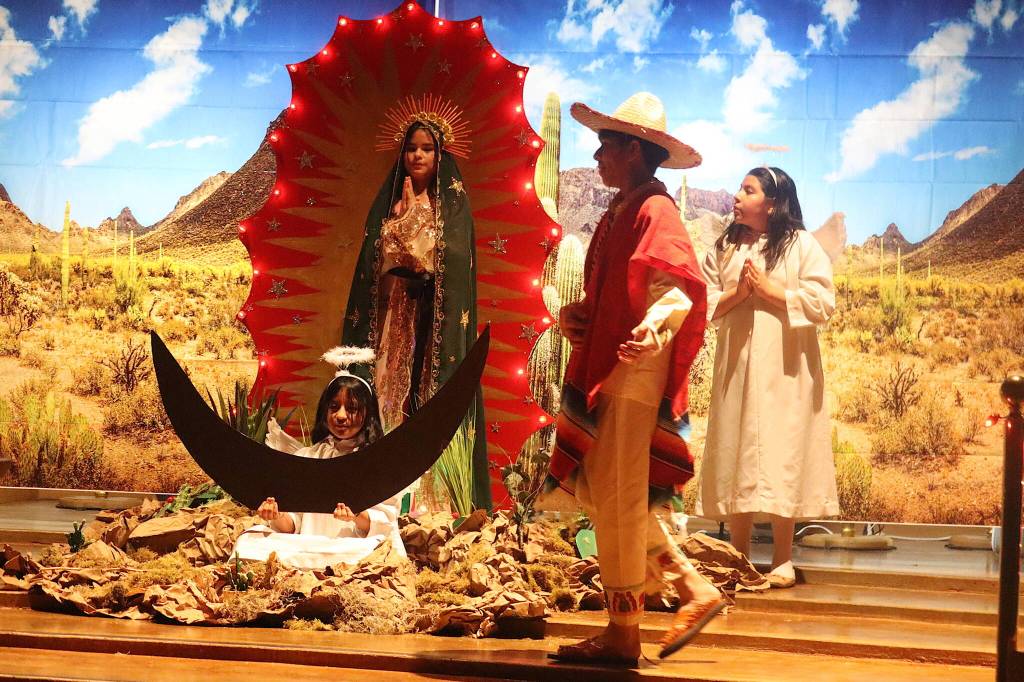 Youths reenact the story of Juan Diego, a Mexican peasant who became a holy visionary after encountering an apparition of the Virgin Mary, during a Feast Day of Our Lady of Guadalupe celebration at St. Pauls Catholic Church on Sunday. (Mark Sabbatini / Juneau Empire)