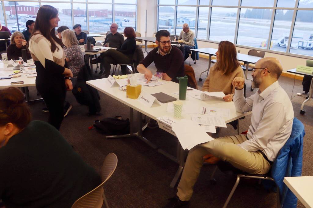 Juneau Assembly members and city administrative leaders participate in group discussions during the Assemblys annual retreat in the main conference room at Juneau International Airport on Saturday. (Mark Sabbatini / Juneau Empire)
