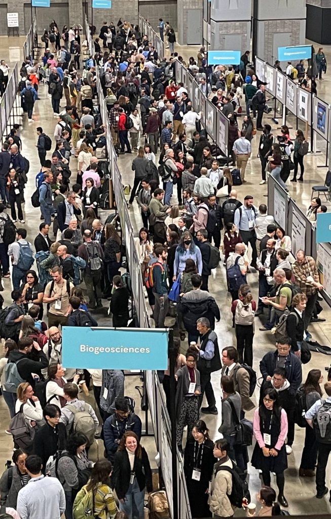 Some of the 25,000 attendees stand at a poster session during the 2024 Fall Meeting of the American Geophysical Union in Washington, D.C. (Photo by Ned Rozell)