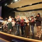 Members of the Juneau Symphony, Vox Borealis and Sitka Holiday Brass rehearse for an annual Holiday Cheer concert Friday at Thunder Mountain Middle School. (Mark Sabbatini / Juneau Empire)