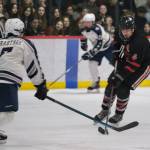 Juneau-Douglas High School: Yadaa.at Kalé senior Luke Bovitz (4) works the puck against Soldotnas Noah Crabtree (7) during Fridays 4-3 Crimson Bears loss to the visiting Stars at Treadwell Ice Arena. (Klas Stolpe / Juneau Empire)