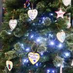 Hand-decorated memorial ornaments hang on a Christmas tree during a Light Up a Life community celebration hosted by the Bartlett Regional Hospitals Home Health and Hospice program Friday evening. (Mark Sabbatini / Juneau Empire)