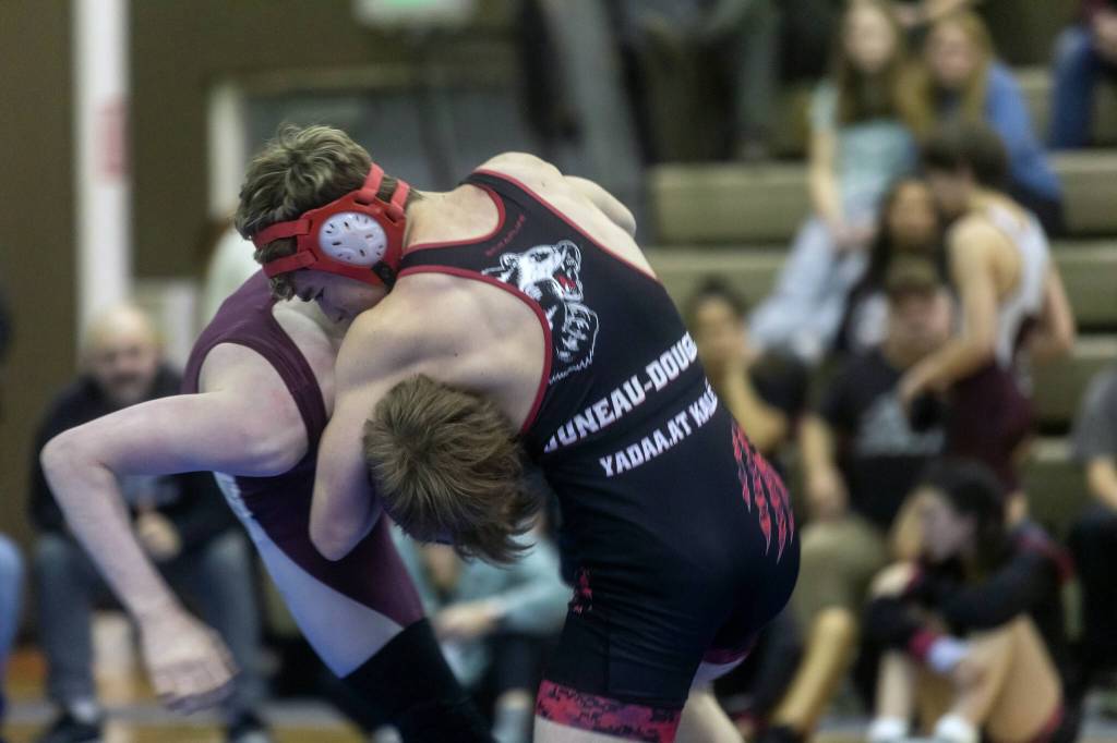 Juneau-Douglas High School: Yadaa.at Kalés Felix Hesson takes Ketchikans Oscar Wutzke down on Friday, Dec. 13, 2024, during the Region V wrestling tournament in Haines. (Rashah McChesney/Chilkat Valley News)