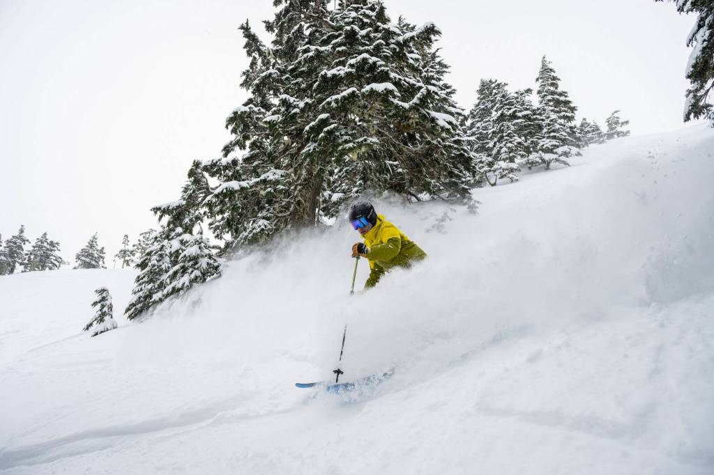 A skier slices through heavy powder on a black diamond run at Eaglecrest Ski Area in Juneau, Alaska, Nov. 28, 2024. The states capital, a popular cruise port in summer, becomes a bargain-seekers base for skiing, skating, hiking and glacier-gazing in the winter off-season. (Christopher S. Miller/The New York Times)