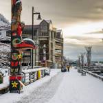 A totem pole, one of 13 on downtowns Totem Pole Trail, along the boardwalk by docks that are mostly empty in winter, in Juneau, Alaska, Nov. 27, 2024. The states capital, a popular cruise port in summer, becomes a bargain-seekers base for skiing, skating, hiking and glacier-gazing in the winter off-season. (Christopher S. Miller/The New York Times)