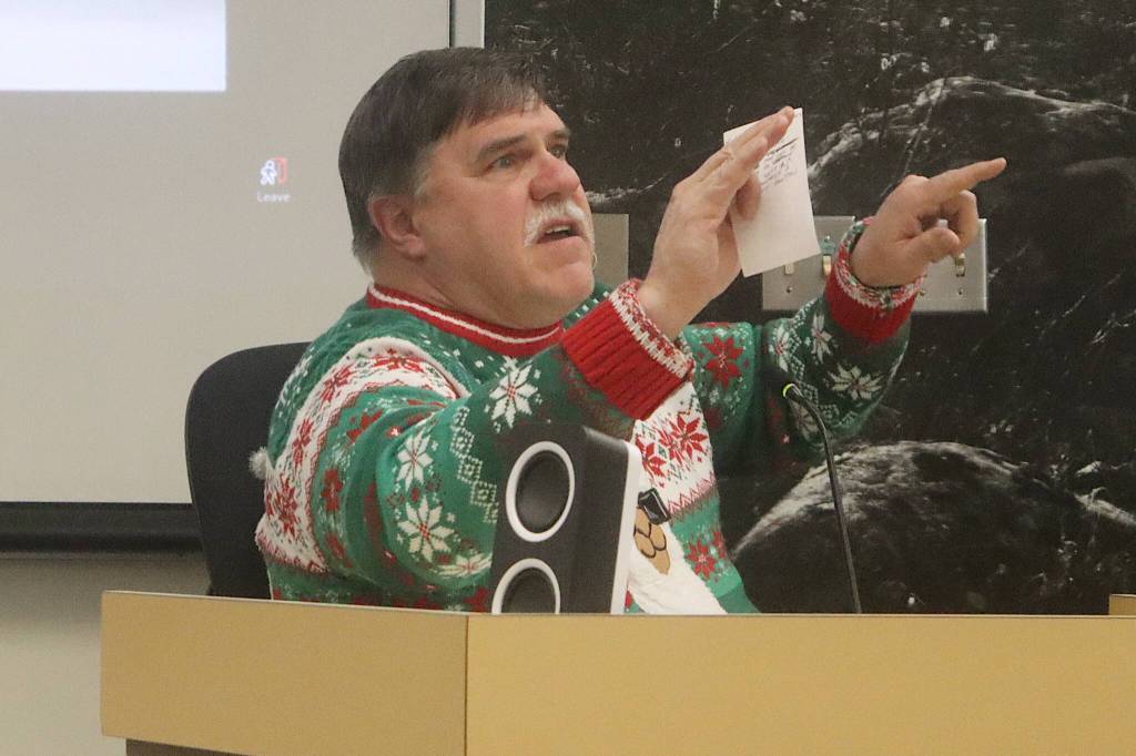 John Cooper, a Meander Way resident, expresses his support during a Juneau Assembly meeting Monday night for a flood protection plan that would require him to pay thousands of dollars to have military-grade flood barriers placed on his property. (Mark Sabbatini / Juneau Empire)