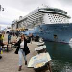 Jasmine Chavez, a crew member aboard the Quantum of the Seas cruise ship, waves to her family during a cell phone conversation after disembarking from the ship at Marine Park on May 10. (Mark Sabbatini / Juneau Empire file photo)