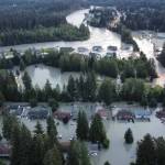 Homes and streets in the Mendenhall Valley are swamped by record flooding from the Mendenhall River on Aug. 6. (Rich Ross / City and Borough of Juneau)