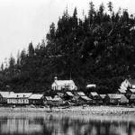 The Wrangell shoreline with about two dozen buildings visible, including a Russian Orthodox church, before the U.S. Army bombardment in 1869. (Alaska State Library, U.S. Army Infantry Brigade photo collection)