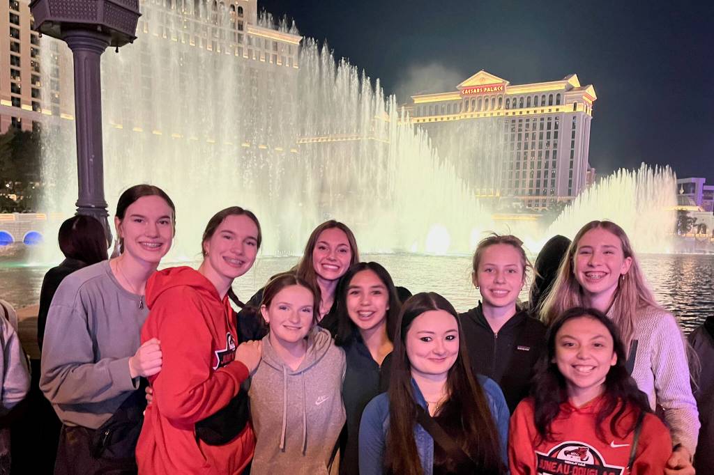 The Juneau-Douglas High School: Yadaa.at Kalé Crimson Bears girls basketball team pose at the Ceasars Palace fountain in Las Vegas during the Tarkanian Classic Tournament. (Photo courtesy JDHS Crimson Bears)