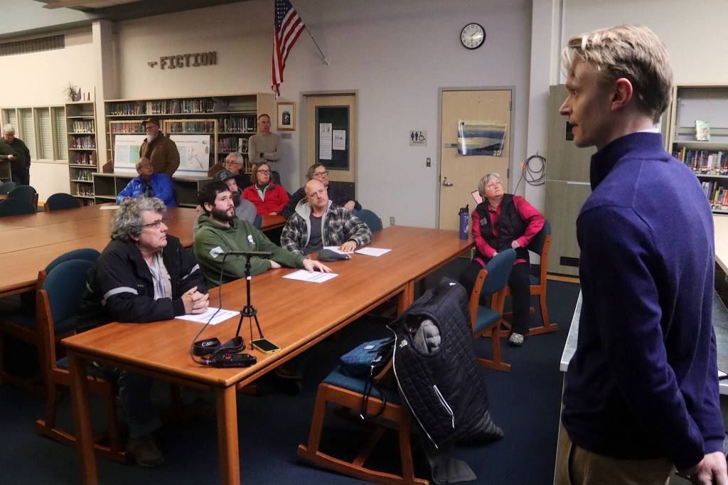 Paul Quinn, a project manager for the FCS Group based in Washington state, explains the process resulting in a proposal to increase water and wastewater rates during a meeting Thursday night at Thunder Mountain Middle School. (Mark Sabbatini / Juneau Empire)