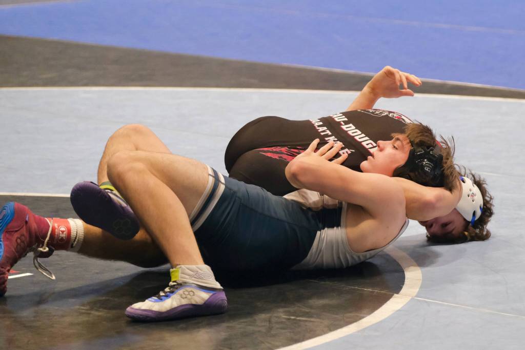 Juneau-Douglas High School: Yadaa.at Kalé senior Justus Darbonne pins Soldotnas Ryatt Weed in the 152-pound fifth-place match during the 2024 ASAA/First National Bank Alaska Wrestling State Championships on Saturday at Anchorages Alaska Airlines Center. (Klas Stolpe / Juneau Empire)