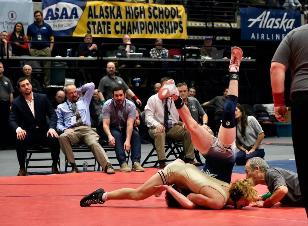 Ketchikan senior Titan Linne pins Soldotnas Titus Watts in front of the Soldotna coaches in the 125-pound Division I championship match of the 2024 ASAA/First National Bank Alaska Wrestling State Championships on Saturday at Anchorages Alaska Airlines Center. (Klas Stolpe / Juneau Empire)
