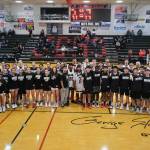 The Juneau-Douglas High School: Yadaa.at Kalé Crimson Bears varsity girls and boys basketball teams pose with alumni players during alumni games Monday at the George Houston Gymnasium. (Klas Stolpe / Juneau Empire)