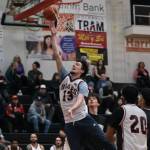2016 Juneau-Douglas High School: Yadaa.at Kalé graduate Kaleb Tompkins scores against the Crimson Bears during alumni games Monday at the George Houston Gymnasium. (Klas Stolpe / Juneau Empire)
