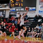 2019 Juneau-Douglas High School: Yadaa.at Kalé graduate Caitlin Pusich scores as Crimson Bears Lydia Goins and June Troxel, 2022 grad Johanna Pasion and the Crimson Bears Athena Warr give chase during alumni games Monday at the George Houston Gymnasium. (Klas Stolpe / Juneau Empire)