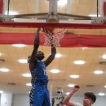 Federal Way senior Saxon Niles (15) attempts a dunk against Soldotna in the opening game of the George Houston Capital City Classic Friday in Juneau. Federal Way won 63-40. (Klas Stolpe / Juneau Empire)