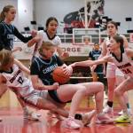 Chugiak senior Emily Desmond secures a rebound as Klawock senior Kaiya Marvin (12) and junior Taylor White (24) go for the ball in the Mustangs 45-25 win over the Chieftains during Saturday action at the George Houston Capital City Classic in Juneau. Chugiak freshman Kaitylyn Farr (3) and Klawock eighth grader Jayla Edenshaw and senior Lea Armour look on.(Klas Stolpe / Juneau Empire)