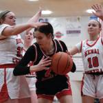Juneau-Douglas High School: Yadaa.at Kalé senior Kerra Baxter (22) works against pressure from Kenai junior Mckenzie Spence (23) sophomore Gracee Every (10) in the Crimson Bears 57-13 win over the Cardinals during Saturday action at the George Houston Capital City Classic in Juneau. (Klas Stolpe / Juneau Empire)