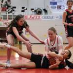 Kenai freshman Hallie Songer and Klawock freshman AnaRose Peratrovich, at left, and eighth grader Jayla Edenshaw go for a loose ball in the Cardinals 45-27 win over the Chieftains during Sunday action at the George Houston Capital City Classic Friday in Juneau. (Klas Stolpe / Juneau Empire)