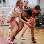 Kenai sophomore Gracee Every and Klawock junior Keira Sanderson battle for a rebound in the Cardinals 45-27 win over the Chieftains during Sunday action at the George Houston Capital City Classic Friday in Juneau. (Klas Stolpe / Juneau Empire)