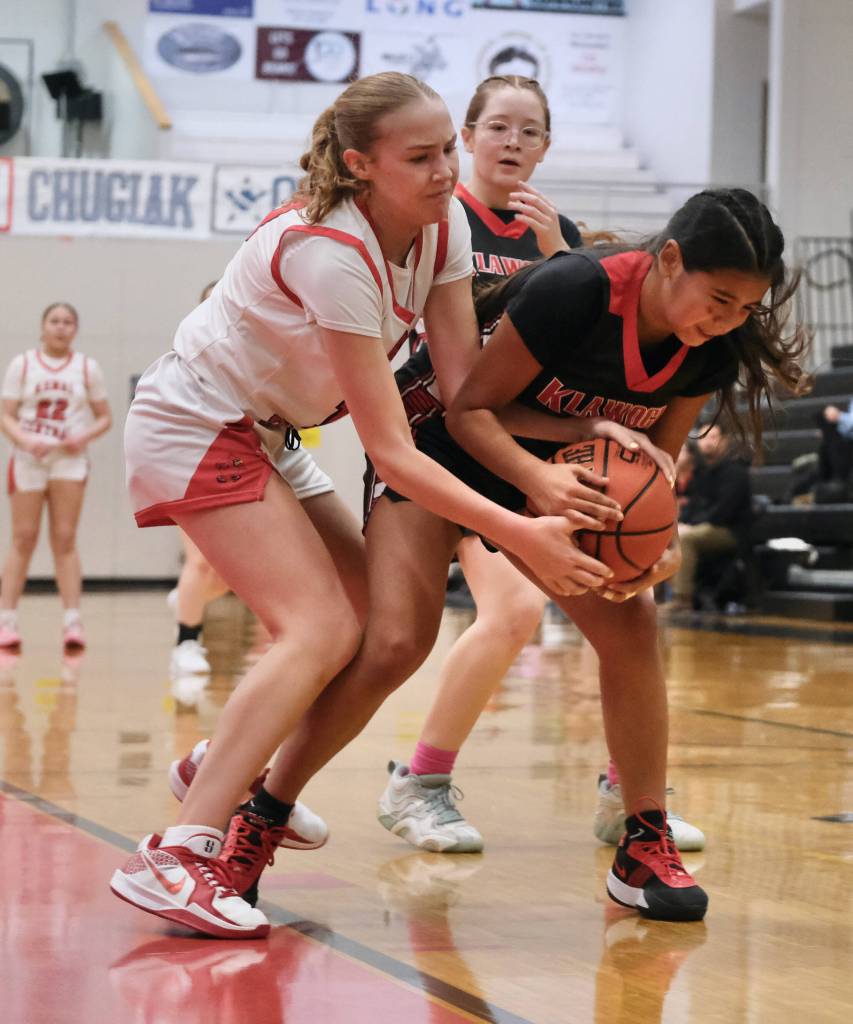 Kenai sophomore Gracee Every and Klawock junior Keira Sanderson battle for a rebound in the Cardinals 45-27 win over the Chieftains during Sunday action at the George Houston Capital City Classic Friday in Juneau. (Klas Stolpe / Juneau Empire)