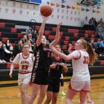 Klawock freshman AnaRose Peratrovich (3) shoots over Kenai junior Ellsi Miller (33) as Kenai junior Mckenzie Spence (23) and Klawock junior Keira Sanderson (1) look on during Sunday action at the George Houston Capital City Classic Friday in Juneau. (Klas Stolpe / Juneau Empire)
