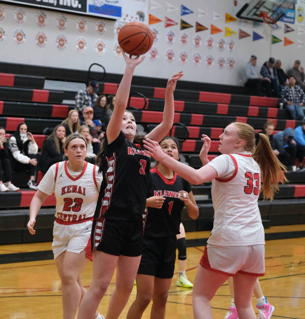 Klawock freshman AnaRose Peratrovich (3) shoots over Kenai junior Ellsi Miller (33) as Kenai junior Mckenzie Spence (23) and Klawock junior Keira Sanderson (1) look on during Sunday action at the George Houston Capital City Classic Friday in Juneau. (Klas Stolpe / Juneau Empire)
