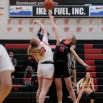Kenai junior Ellsi Miller (33) and Klawock senior Kaiya Marvin (12) jump center to open the final day of the George Houston Capital City Classic on Sunday in Juneau. (Klas Stolpe / Juneau Empire)