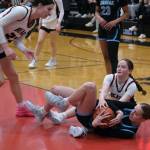 Juneau-Douglas High School: Yadaa.at Kalé junior Cambry Lockhart battles for a loose ball with Chugiak freshman Kaitlyn Farr during the Crimson Bears 51-38 win over the Mustangs in the girls championship game at the George Houston Capital City Classic on Sunday in Juneau. (Klas Stolpe / Juneau Empire)
