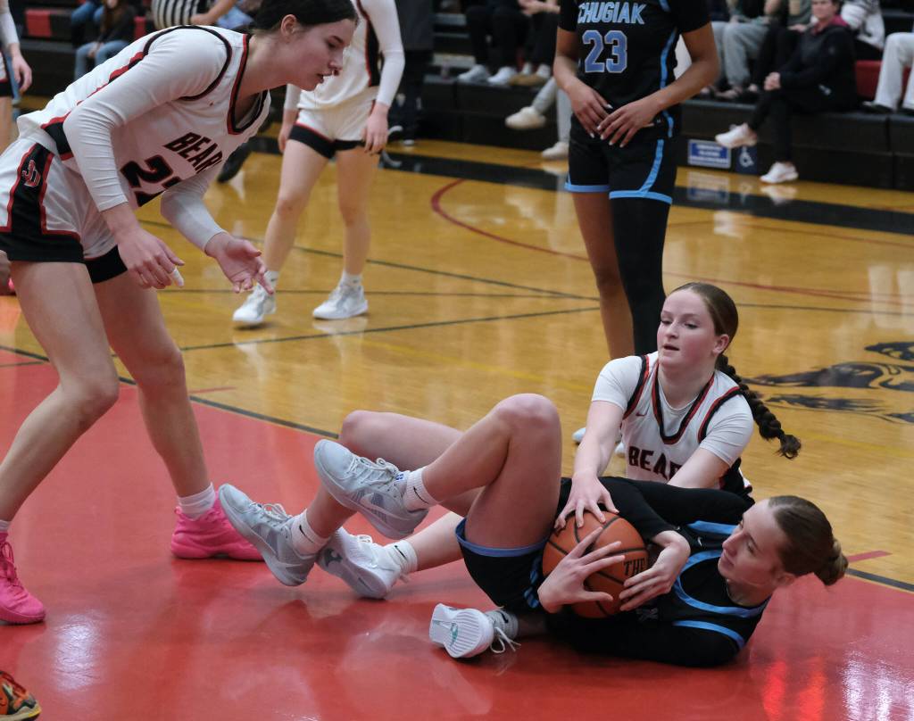 Juneau-Douglas High School: Yadaa.at Kalé junior Cambry Lockhart battles for a loose ball with Chugiak freshman Kaitlyn Farr during the Crimson Bears 51-38 win over the Mustangs in the girls championship game at the George Houston Capital City Classic on Sunday in Juneau. (Klas Stolpe / Juneau Empire)