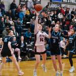 Juneau-Douglas High School: Yadaa.at Kalé sophomore Layla Tokuoka (14) shoots over Chugiak freshman Kaitlyn Farr (3) as senior Emily Desmond (15) and sophomore Natalie Horn (23) look on during the girls championship game at the George Houston Capital City Classic on Sunday in Juneau. (Klas Stolpe / Juneau Empire)