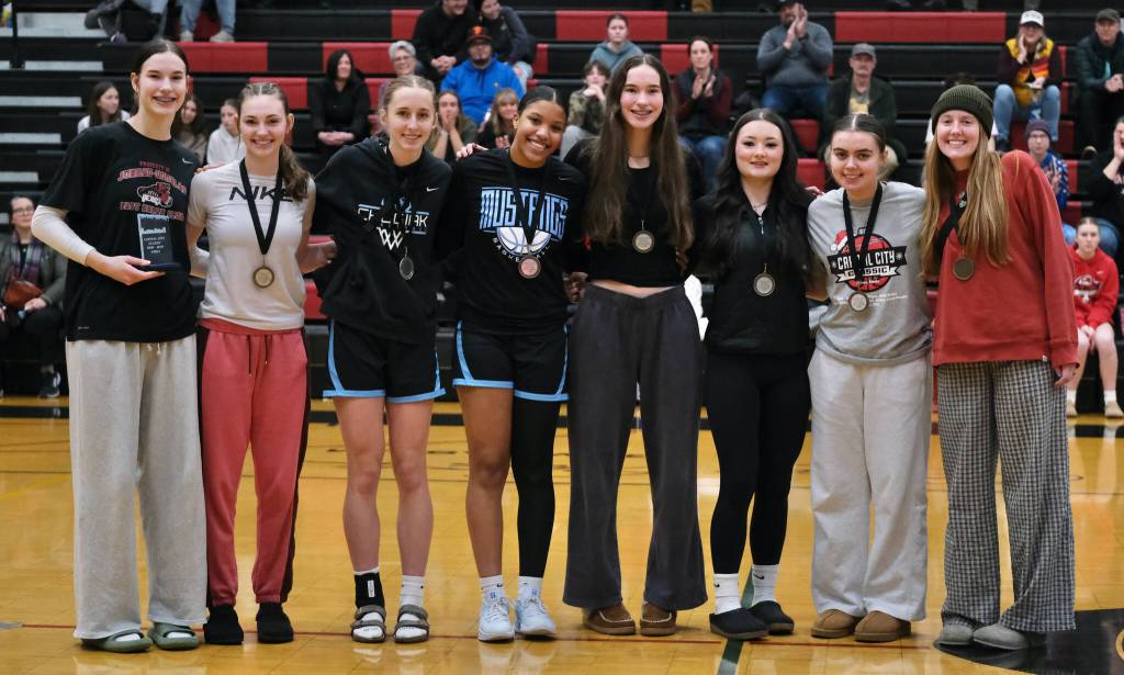 The 2024 George Houston Capital City Classic girls All Tournament Team, from left-to-right, MVP Kerra Baxter (Juneau-Douglas High School: Yadaa.at Kalé), Gwen Nizich (JDHS), Kaitlyn Farr (Chugiak), Natalie Horn (Chugiak), Cailynn Baxter (JDHS), Layla Tokuoka (JDHS), Lea Armour (Klawock) and Ellsi Miller (Kenai). (Klas Stolpe / Juneau Empire)
