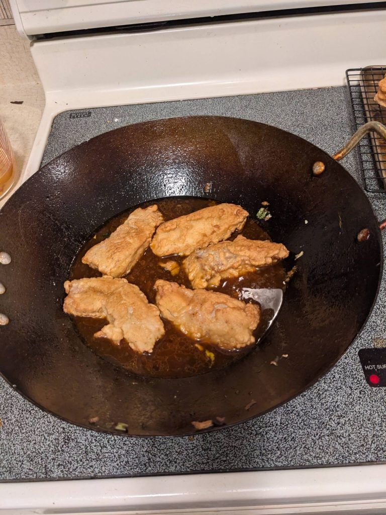 Frying Szechwan-style fish. (Photo by Patty Schied)