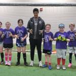The 32nd Annual Holiday Cup Soccer Tournament Elementary Division champions Nutmeggers pose Tuesday, Dec. 31, at the Dimond Park Field House after victory. (Klas Stolpe / Juneau Empire)