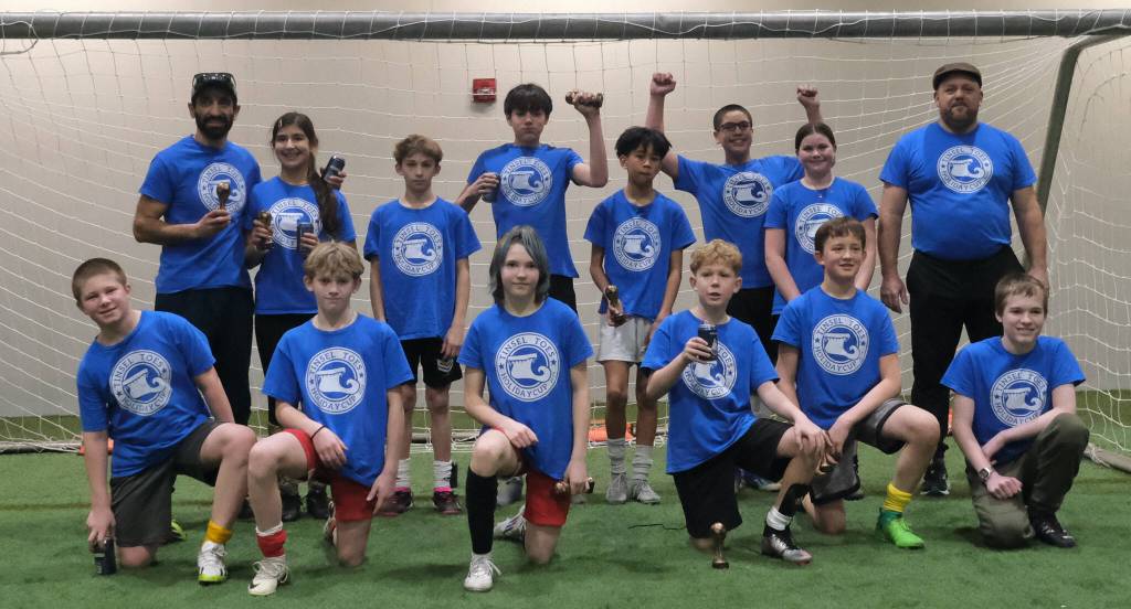 The 32nd Annual Holiday Cup Soccer Tournament Middle School Division champions Tinsel Toes pose Tuesday, Dec. 31, at the Dimond Park Field House after victory. (Klas Stolpe / Juneau Empire)