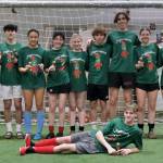 The 32nd Annual Holiday Cup Soccer Tournament High School Division champions Jingle Ballers pose Tuesday, Dec. 31, at the Dimond Park Field House after victory. (Klas Stolpe / Juneau Empire)