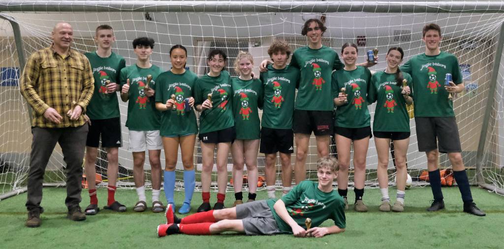 The 32nd Annual Holiday Cup Soccer Tournament High School Division champions Jingle Ballers pose Tuesday, Dec. 31, at the Dimond Park Field House after victory. (Klas Stolpe / Juneau Empire)