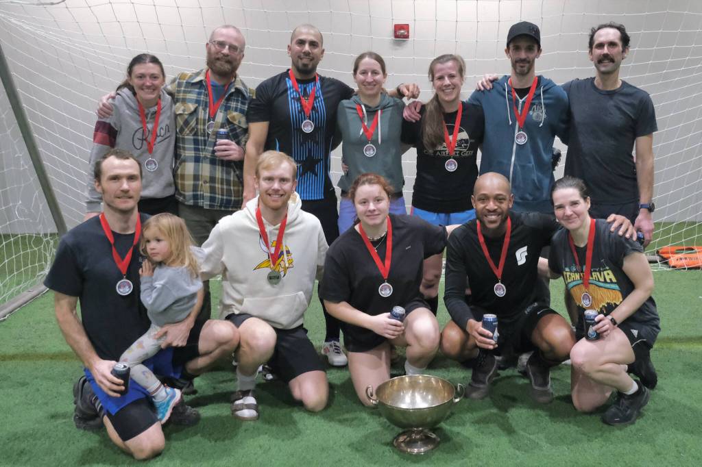 The 32nd Annual Holiday Cup Soccer Tournament Masters Division champions Eggnog and Nutmegs pose Tuesday, Dec. 31, at the Dimond Park Field House after victory. (Klas Stolpe / Juneau Empire)