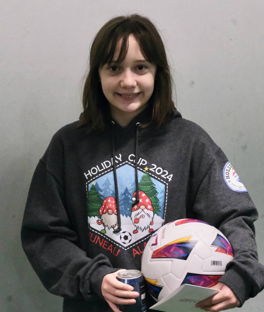 The Holiday Cup 2024 sweatshirt design contest winner Makenna Paddleford wearing her winning design on Tuesday, Dec. 31, at the Dimond Park Field House. (Klas Stolpe / Juneau Empire)