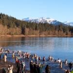 Hundreds of people plunge into Auke Rec on New Years Day in Juneau. (Jasz Garrett / Juneau Empire)
