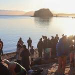 Juneau residents enjoy the sunshine at Auke Rec following the Polar Bear Dip. (Jasz Garrett / Juneau Empire)