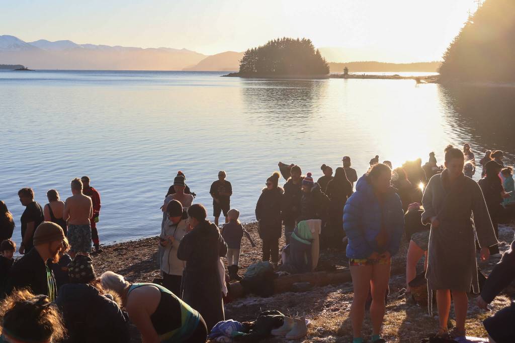 Juneau residents enjoy the sunshine at Auke Rec following the Polar Bear Dip. (Jasz Garrett / Juneau Empire)